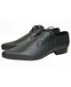 Black textured leather oxford Nevermind with snake‑pattern design.