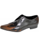 Oxford in black and brown gradient leather – with sculptural flame motif and elegant silhouette.
