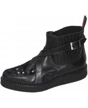 Creeper cuir noir et fourrure bovine avec sangle croisée et élastique.