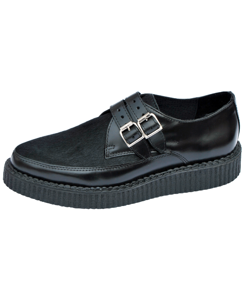 Double-buckle black leather creepers with hair-on upper and 3 cm rubber sole – Nevermind.