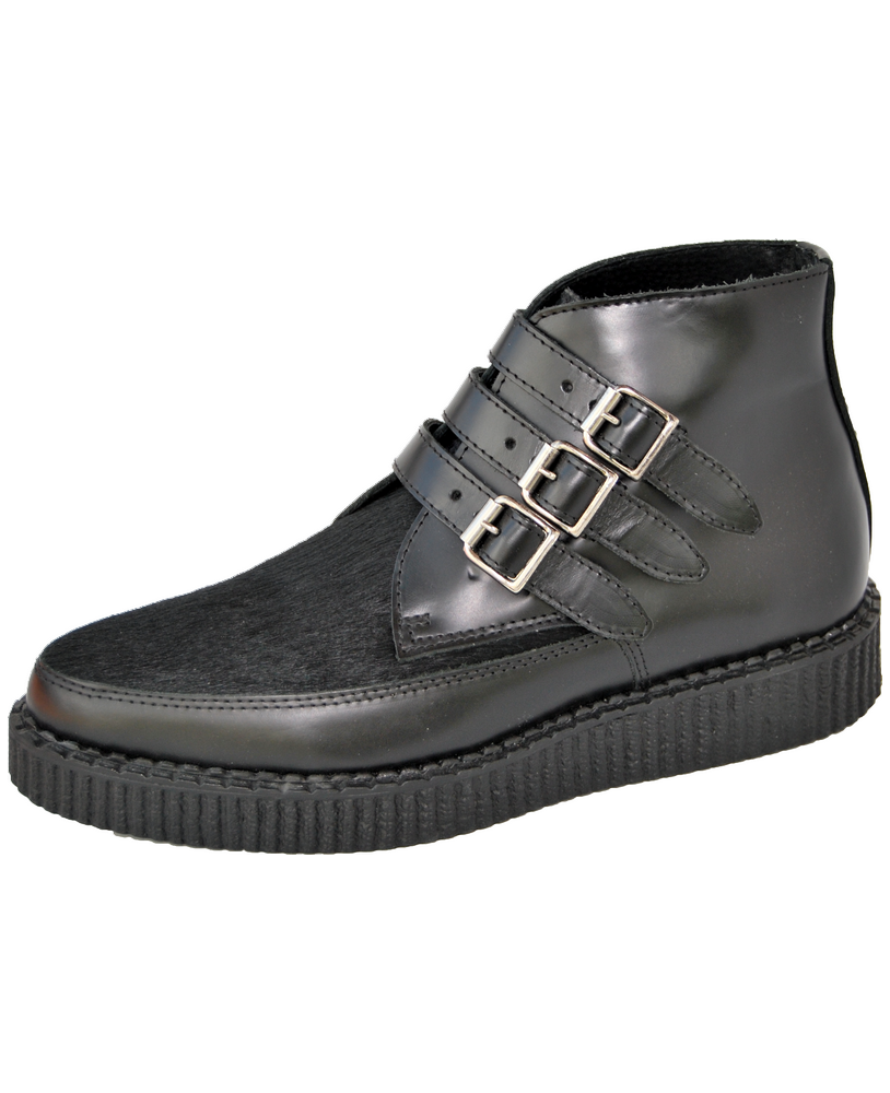 Black leather creeper with bovine fur and triple metal straps.