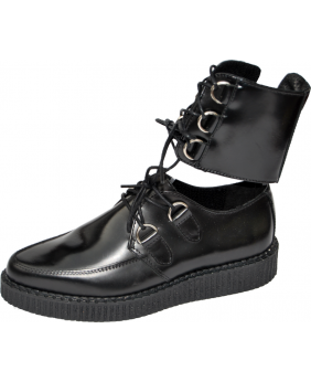 Creepers basses Nevermind en cuir noir avec laçage cheville et anneaux métalliques.