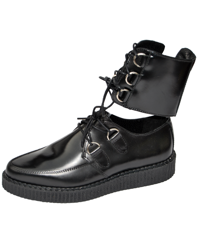 Creepers basses Nevermind en cuir noir avec laçage cheville et anneaux métalliques.