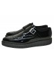 Creepers Nevermind puntiagudos en charol negro con hebilla.