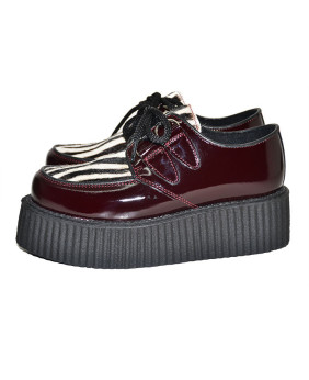 Nevermind burgundy patent leather and black/white zebra cowhide creepers – wild, stylish, and underground.