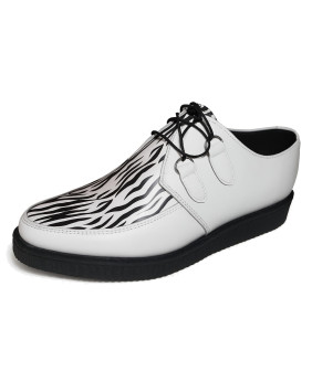 Creepers Nevermind en cuero blanco con estampado de cebra, suela de goma negra de 3 cm.
