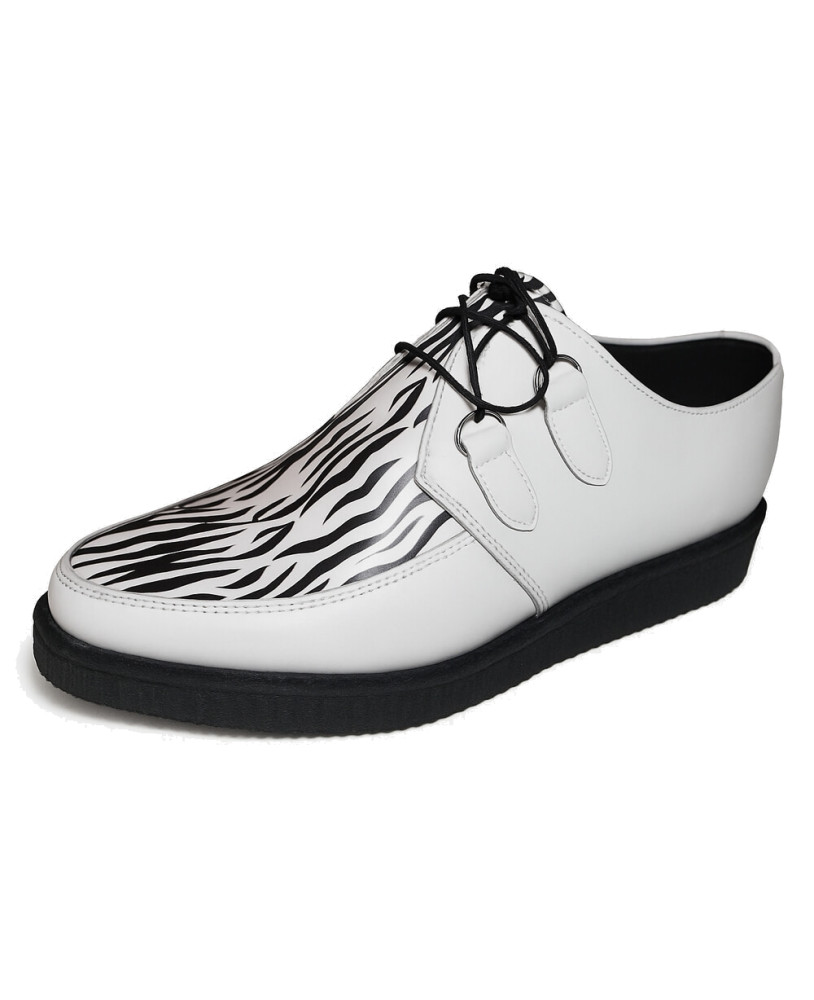 Creepers Nevermind en cuero blanco con estampado de cebra, suela de goma negra de 3 cm.
