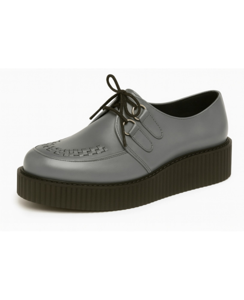Creepers Nevermind en cuir lisse gris acier avec tressage artisanal et semelle noire massive.