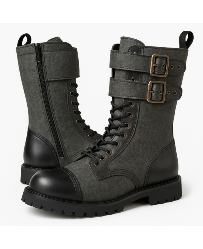 Rangers Nevermind 10 œillets en cuir noir et tissu vert, avec double boucles, zip et bout coqué – style alternatif et robuste.