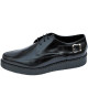 Creepers Nevermind a punta in pelle nera lucida con fibbie laterali.