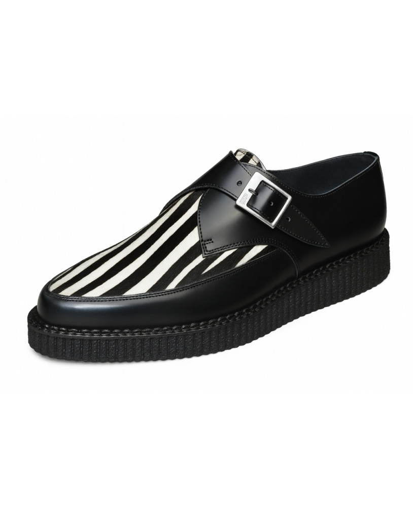 Nevermind pointed creepers in black leather with zebra-pattern bovine fur and silver buckle.