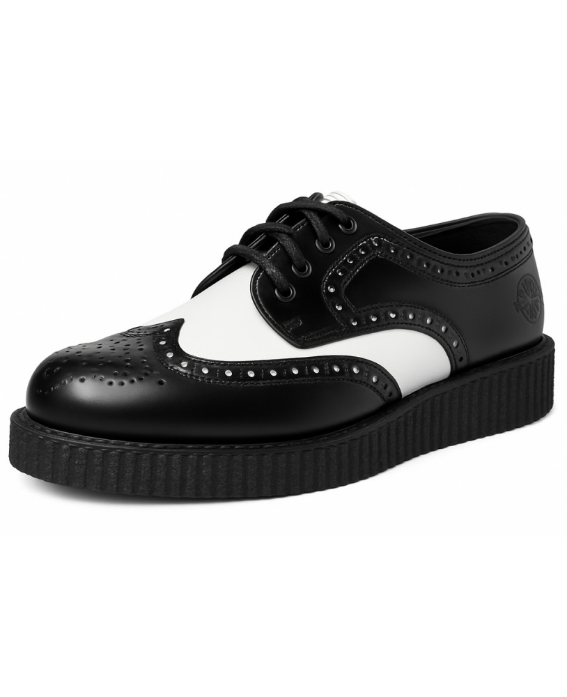 Nevermind black and white leather creepers with decorative perforations and ridged sole.