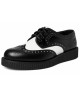 Nevermind black and white leather creepers with decorative perforations and ridged sole.