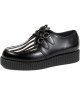 Creepers Nevermind à simple semelle en cuir noir et fourrure bovine imprimée zèbre.