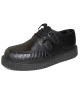 Creepers en cuir noir embossé effet anaconda – style audacieux et esprit alternatif.