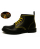 Black leather ankle boots with yellow stitching and yellow laces.