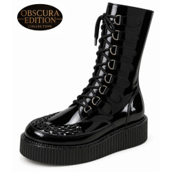 Nevermind Obscura Edition creeper boots in black patent leather with a platform rubber sole, lacing and metal buckle straps.