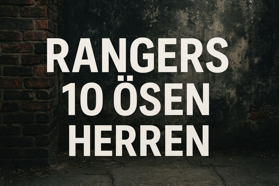 Riesen-Textwand: Weißer Schriftzug „RANGERS 10 ÖSEN HERREN“ auf dunkler, rauer Wand/Backsteinwand. urbanes, rohes Design.