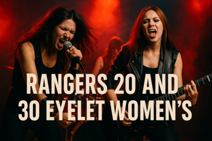 Two female rock singers perform on stage with microphones and a guitarist, wearing black outfits under red stage lighting.